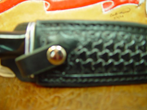 Custom Right-hand Leather knife sheath for the Buck 119 dyed black. Made with Authentic Buffalo Hide Leather and has round basket-weave tooling with strap. Sheath ONLY!!!!