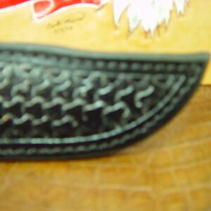 Custom Right-hand Leather knife sheath for the Buck 119 dyed black. Made with Authentic Buffalo Hide Leather and has round basket-weave tooling with strap. Sheath ONLY!!!!