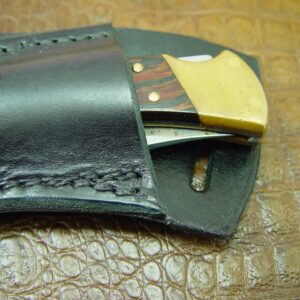 Custom Left Hand Cross Draw Knife Sheath for a Buck 110 Knife. The Sheath is Made Out of Buffalo Hide Leather Dyed Black.