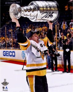 jake guentzel pittsburgh penguins 2017 stanley cup champions autographed 8" x 10" raising cup photograph - autographed nhl photos