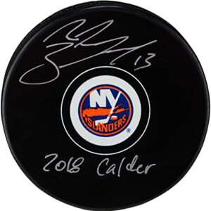 mathew barzal new york islanders autographed hockey puck with "2018 calder" inscription - autographed nhl pucks