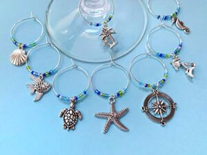 caribbean beach themed wine charms, gift for island beach getaway, beach themed, tropical vacation, summer by the sea, set of 8. sea glass beads.