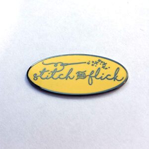 stitch and flick (yellow/black) hard enamel needle minder