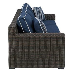 Signature Design by Ashley Grasson Lane Outdoor Patio Wicker Sofa with Cushion and 2 Pillows, Brown & Blue