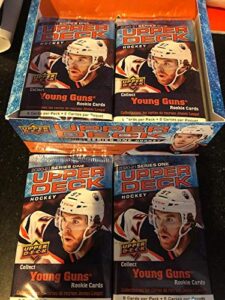 lot of 4 factory sealed retail packs of 2020-2021 upper deck hockey chance for young guns canvas, memorabilia cards. very unlikely to get a young guns rookie, however. do not expect to get one chase regular and insert cards of stars such as sidney crosby,