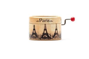 little music box decorated with the paris eiffel tower and with the melody la vie en rose.