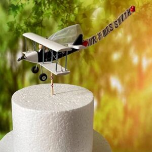 airplane wedding cake topper with custom banner mr. & mrs. cute unique honeymoon figurines at the helm of the plane