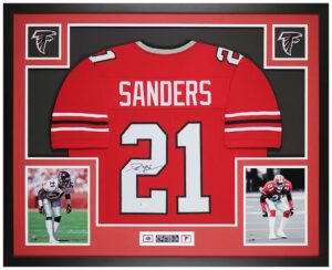 deion sanders autographed red atlanta jersey - beautifully matted and framed - hand signed by deion and certified authentic by beckett - includes certificate of authenticity