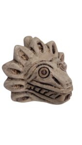 quetzalcoatl death whistle made of clay, replica of items found in aztec temple. (natural)