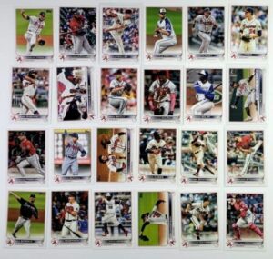 2022 topps complete (series 1 & 2) atlanta braves team set of 24 plus bonus sealed pack of 2024 topps baseball - look for relics and autographs cards inc riley, strider rc, acuna and a bonus pack of 2023 topps 1 bb - look for autos,relics and rc
