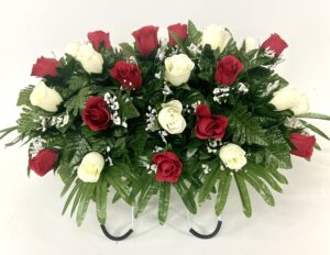 cemetery headstone saddle flower arrangement in red and cream roses-grave marker decoration, sympathy flowers