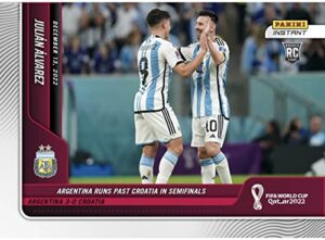 2022 panini instant world cup julian alvarez rc with lionel messi #109- argentina runs past croatia in semifinals -12/13/22 -soccer trading card- argentina - print run of only 2954 made! shipped in protective screwdown holder.