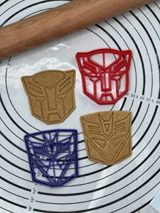 set of 2 autobots decepticons logo cookie cutters & molds 3.5” inches produced by 3d kitchen art