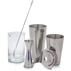 the art of craft professional bartending set for shaken and stirred drinks: boston cocktail shaker, hawthorne strainer, japanese jigger, bar spoon and crystal mixing glass