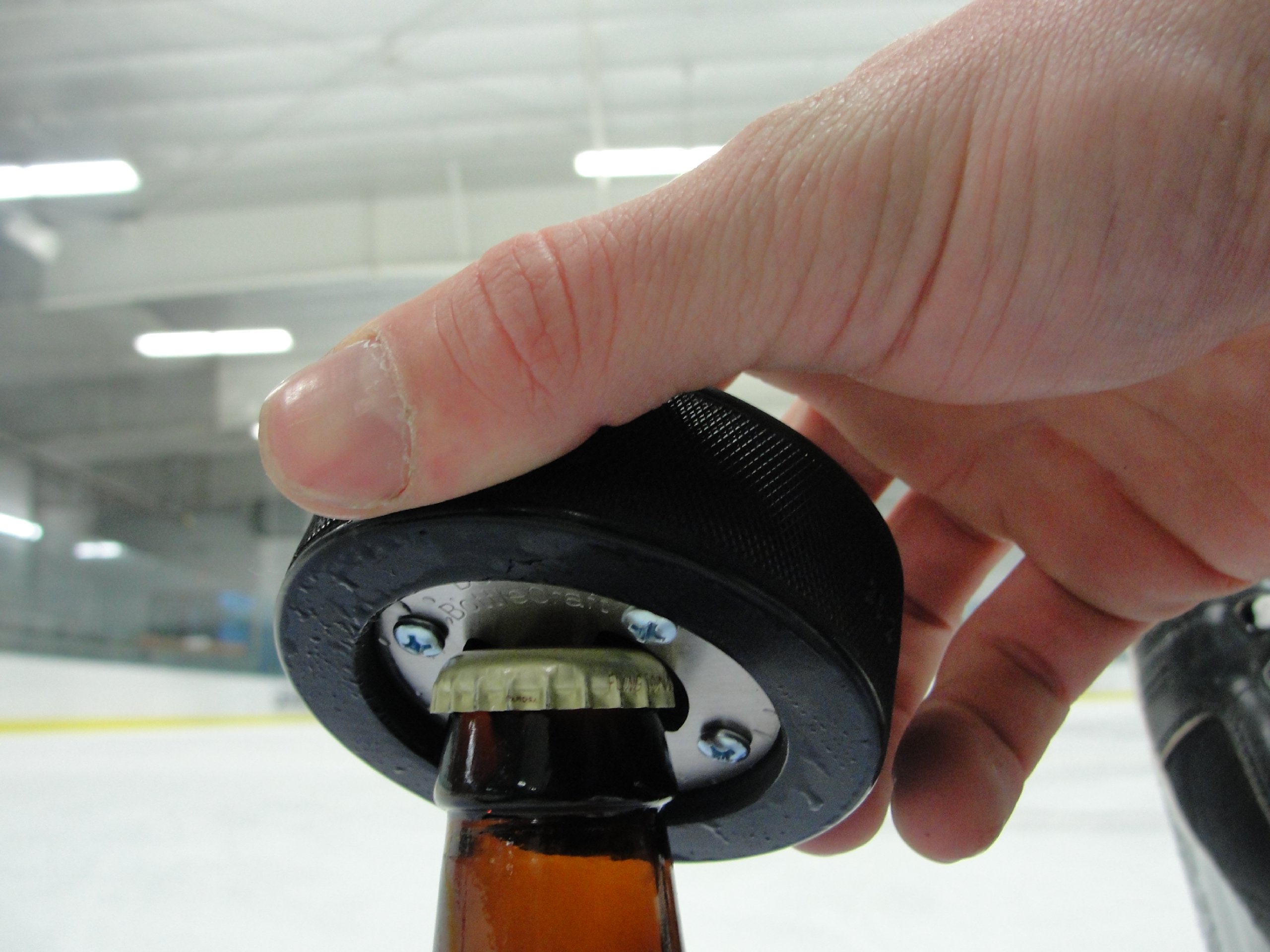 Canadian Maple Leaf Bottle Opener, Made from a real Hockey Puck