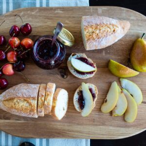 LUX American Oak Wood Oversized Serving Board 20.5" x 13" | Extra Large Charcuterie Board | Cheese Board With Handle for Serving Cheeses, Meats, Crackers, and Wine | Unique Gift (Oval Cutting Board)