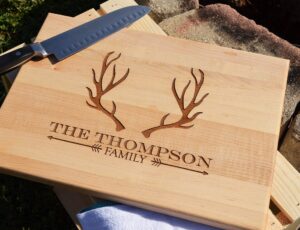 personalized laser engraved wood cutting board with deer antler design