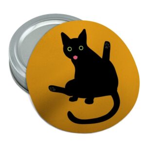 black cat lifting leg and licking round rubber non-slip jar gripper lid opener