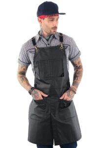 under ny sky cross-back panther black apron – coated twill with leather reinforcement and split-leg – adjustable for men and women – pro barber, tattoo, hair stylist, barista, bartender, server aprons