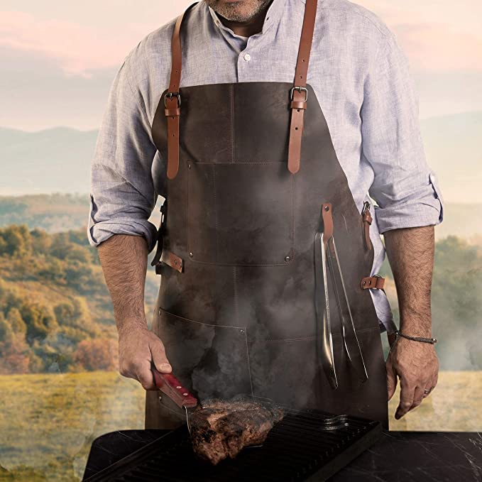 Theodore Top Grain Leather Apron - 32.5” H x 24.5” W with Adjustable Crossback Leather Straps. Our Leather Apron for Men has 2 Large Pockets and a Towel Strap. Grill Apron is Flame & Heat Resistant