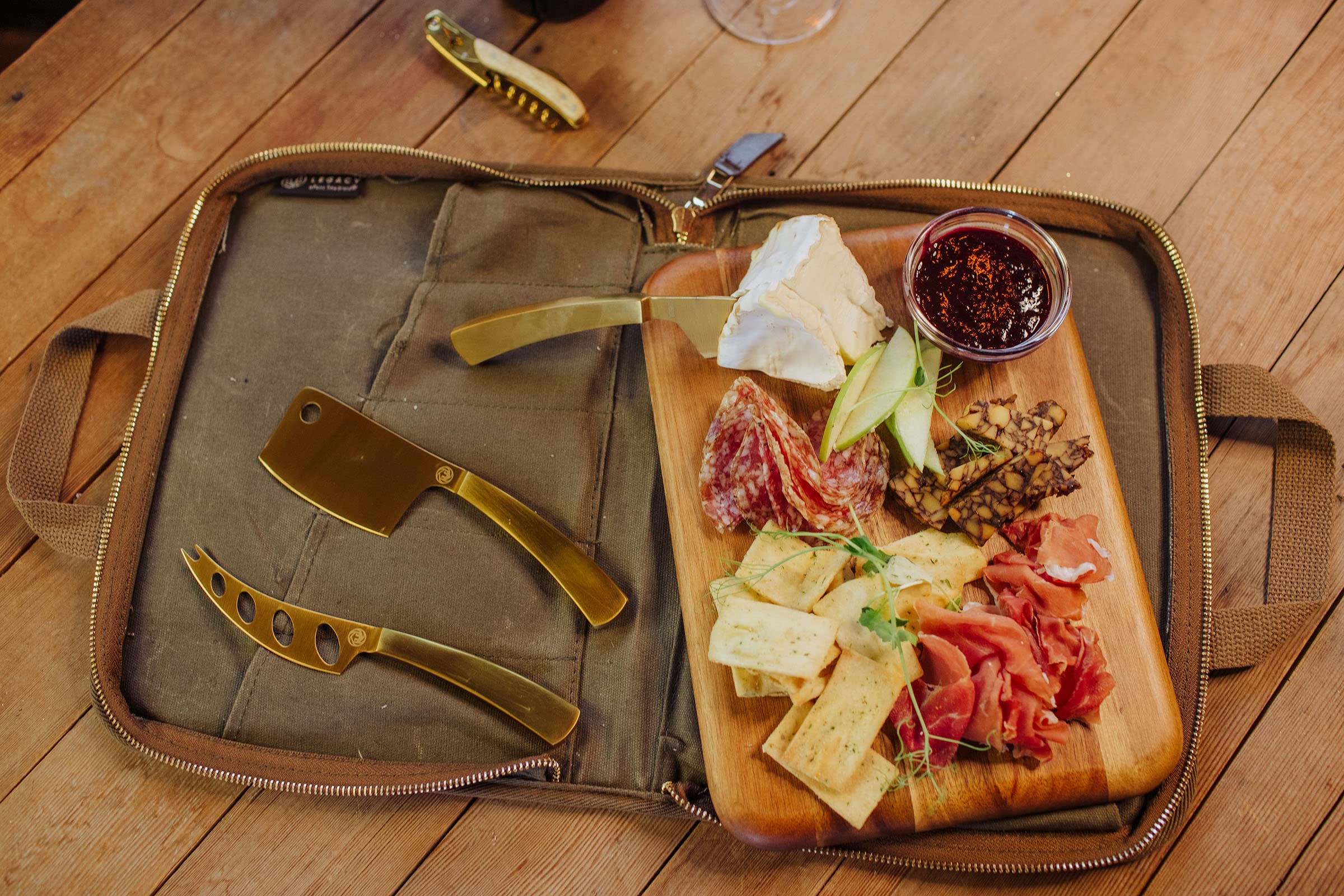 LEGACY - A Picnic Time Brand Monterey Travel Set-Distressed Waxed Canvas Bag with Cheese Knifes and Cutting Board, Khaki Green