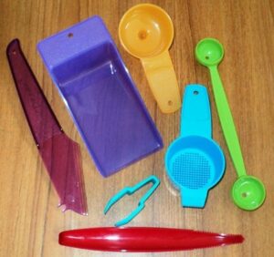 7 new tupperware gadgets ~ strawberry huller, hand held strainer and funnel, flat scoop, cheese knife, melon baller, lettuce corer