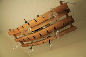 hanging wine bottle and glass rack made from oak wine barrel staves