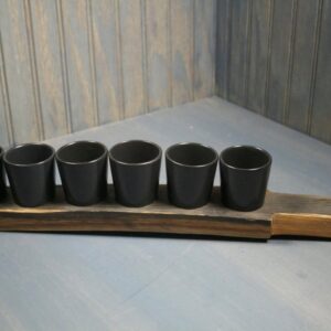 WHISKEY BARREL SHOT PADDLE WITH BLACK CERAMIC SHOT GLASSES - Black Ceramic shot glasses with a reclaimed whiskey barrel shot paddle and leather handle, 6 shot glasses/sake cups included