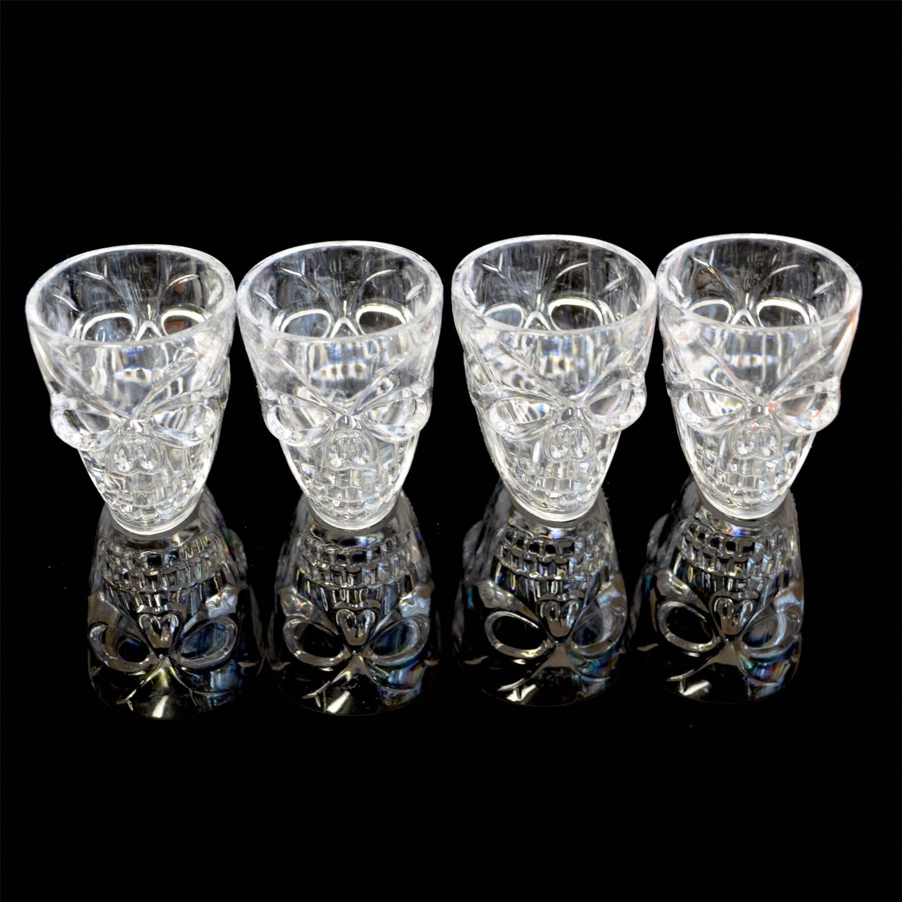 SHATCHI Set of 4 Halloween Clear Shot Glasses with Spooky 3D Skull Shape Party Tableware Drink Accessories, 4 Count (Pack of 1), 55 milliliters