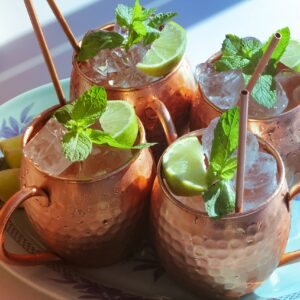 Moscow Mule Copper Mugs Set - 4 Authentic Handcrafted Copper Mugs (16 oz.) with 2 oz. Shot Glass, 4 Straws, 4 Solid Wood Coasters and Recipe Book - Gift Box Included