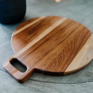 Round charcuterie serving board with handle, handmade in the USA with Walnut hardwood.