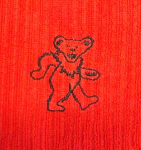 kitchen towel with an embroidered dancing bear - red and black