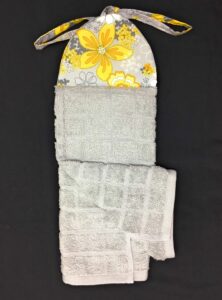 white and yellow flowers on grey gray ties on stays put kitchen hanging loop hand dish towel