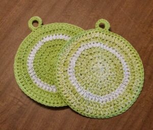hand crocheted large round potholders, double thick cotton, set of two, reversible (key lime green splash, solid key lime green)