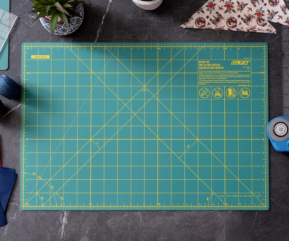 OLFA 12" x 18" Self Healing Rotary Cutting Mat (RM-CG) - Double Sided 12x18 Inch Cutting Mat with Grid for Quilting, Sewing, Fabric, & Crafts, Designed for Use with Rotary Cutters (Green)