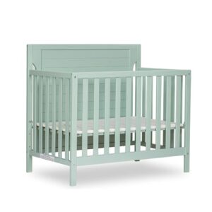 dream on me bellport 4 in 1 convertible mini/portable crib in light seafoam green, non-toxic finish, made of sustainable new zealand pinewood, with 3 mattress height settings