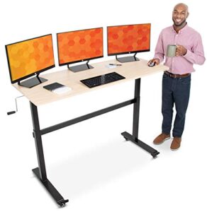 stand steady tranzendesk | 55 inch standing desk with detachable wheels | crank height adjustable sit to stand workstation | modern ergonomic desk supports 3 monitors  (maple)