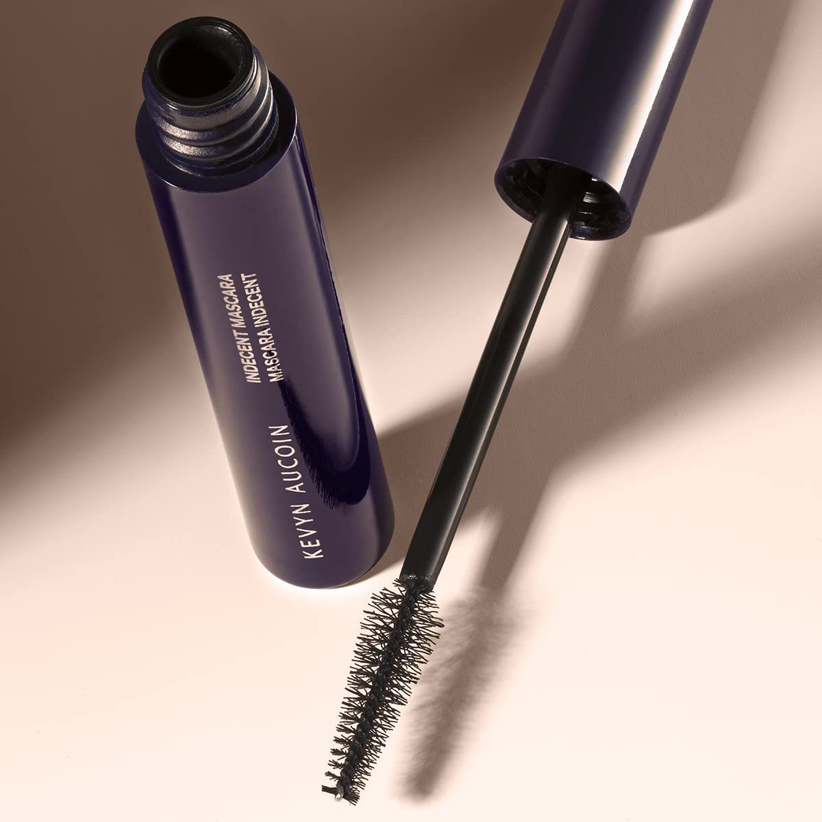 Kevyn Aucoin Indecent Mascara, Black: Thin cone-shaped brush. Creamy lash condition formula. Dramatic and natural look. Long wear. Clump & flake-free. Pro makeup artist go to for defined fuller lashes