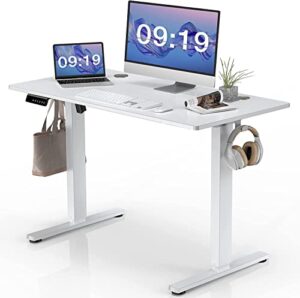 smug standing desk, 40 x 24 in electric height adjustable computer desk for home office, sit stand up work gaming table with memory controller/headphone hook, rising lift workstation-white