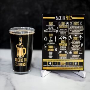 Greenline Goods Happy Birthday Beer Pint Glass (16 oz) & 2002 Birthday Year Facts Board Set with Stand Included - 21st Birthday for Men and Women - Cheers to 21 Years!