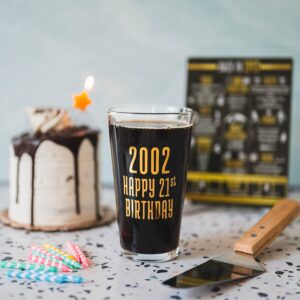 Greenline Goods Happy Birthday Beer Pint Glass (16 oz) & 2002 Birthday Year Facts Board Set with Stand Included - 21st Birthday for Men and Women - Cheers to 21 Years!