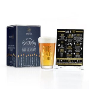 Greenline Goods Happy Birthday Beer Pint Glass (16 oz) & 2002 Birthday Year Facts Board Set with Stand Included - 21st Birthday for Men and Women - Cheers to 21 Years!