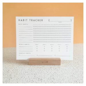 habit tracker calendar with wood stand,daily goal and accountability journal with 12 paper sheets for a year,develop better habits, goal tracker, period tracker, fitness, and overall well-being