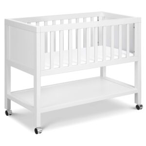 davinci archie portable bassinet in white, removeable wheels, greenguard gold certified