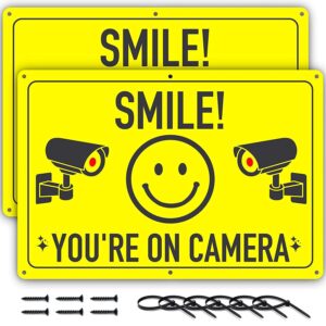 assured signs smile you're on camera sign - 11.75 x 8 inch - 2 pack - ideal aluminum video surveillance security signs to prevent trespassing on private property - perfect for house, business, yard or private driveway