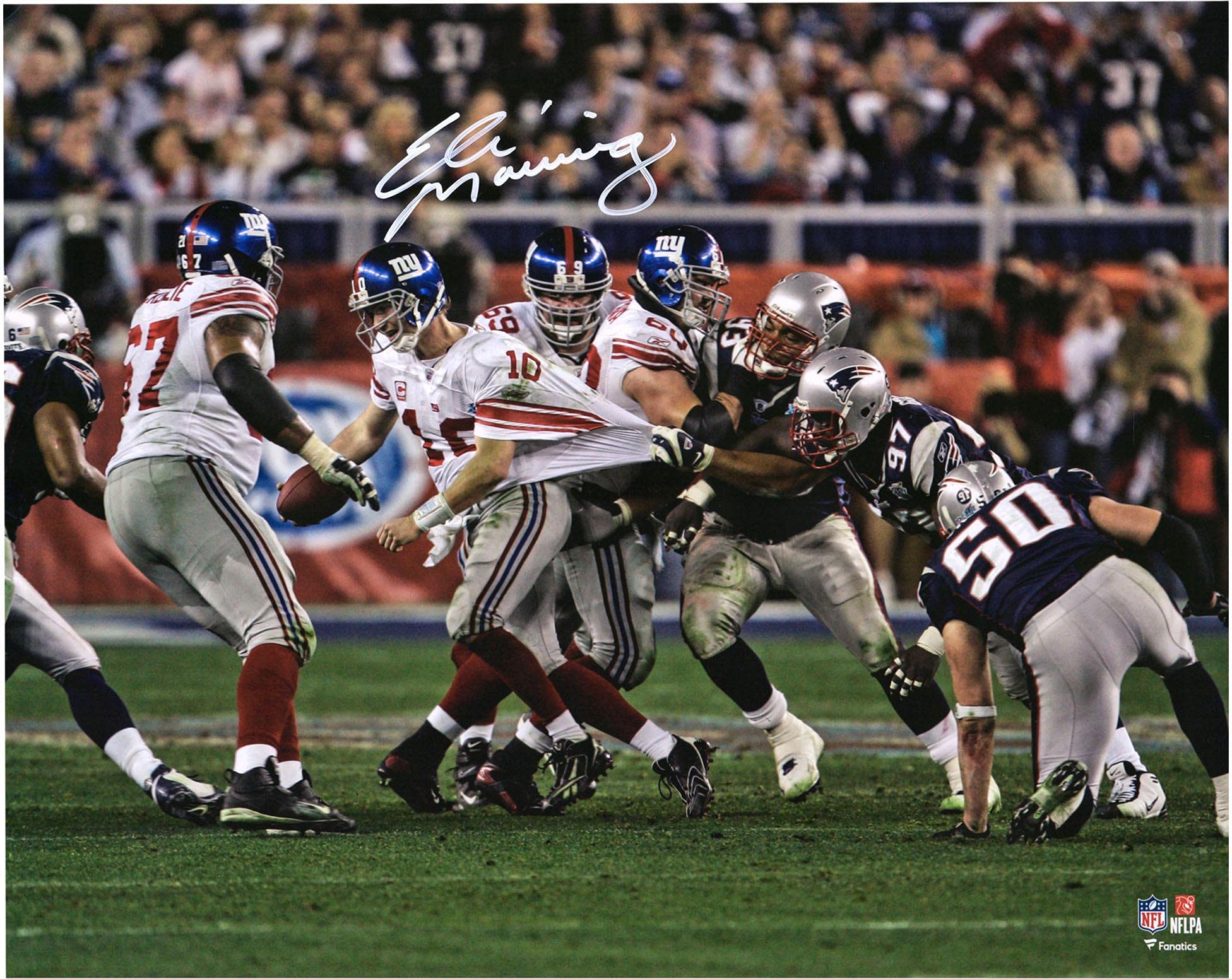 Eli Manning New York Giants Autographed 16" x 20" Super Bowl XLII Escaping Tackle Photograph - Autographed NFL Photos