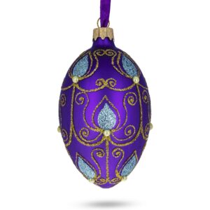 blue leaf on purple glass egg ornament 4 inches