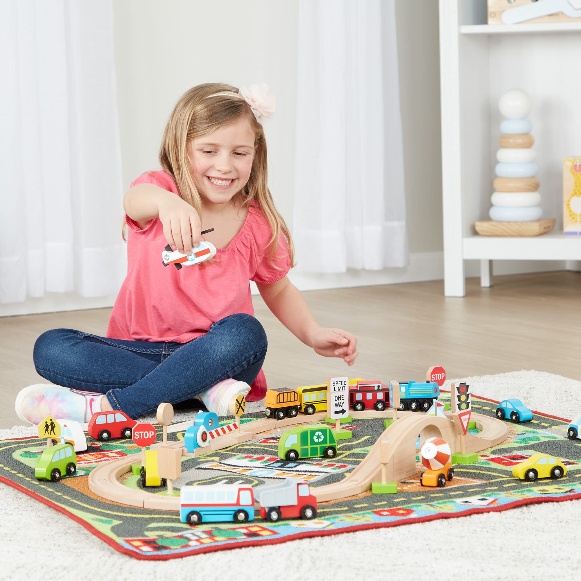 Melissa & Doug Deluxe Multi-Vehicle Activity Rug (39.5" x 36.5") - 19 Vehicles, 12 Wooden Signs, Train Tracks