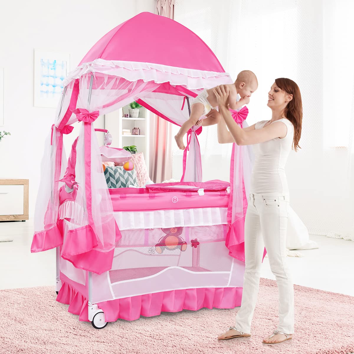 BABY JOY 4 in 1 Pack and Play with Extended Canopy, Portable Baby Playard Bedside Sleeper with Side Zipper Entrance, Wheels & Brake, Baby Girl Pink Bassinet Crib from Newborn to Toddler