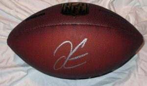 derek carr autographed wilson nfl shield football w/proof, picture of derek signing for us, oakland raiders, fresno state bulldogs, 2014 nfl draft, top prospect